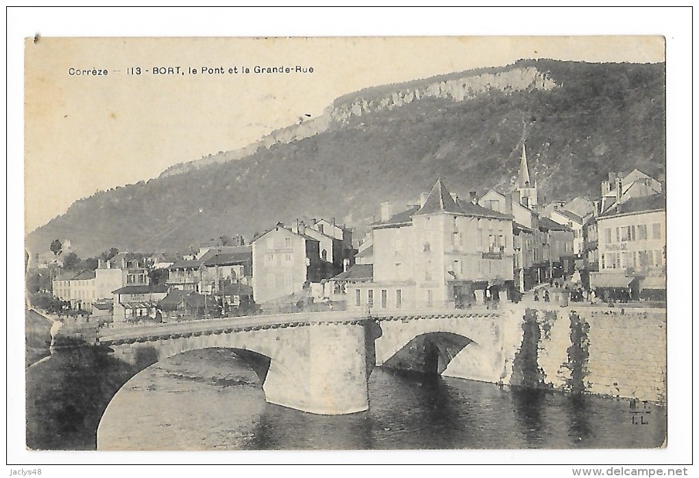 BORT-les-ORGUES  (cpa 19)  Le Pont Et La Grande Rue -  --- L 1 - Autres & Non Classés