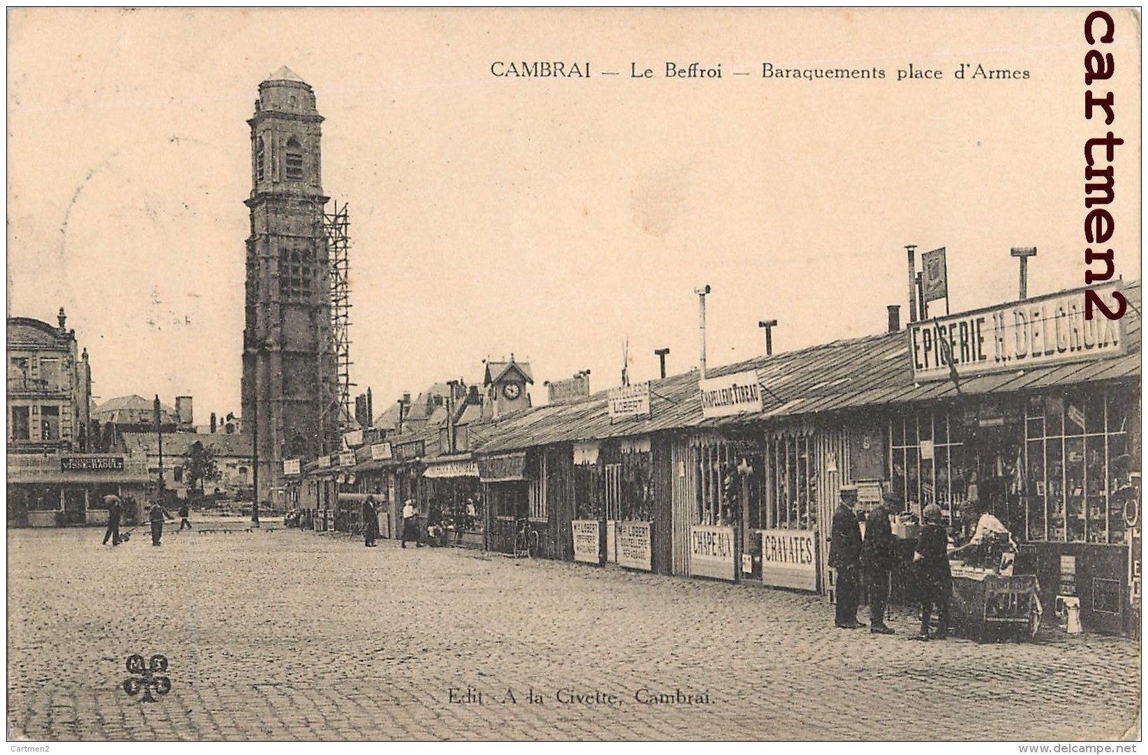 RARE CPA : CAMBRAI LA PLACE D'ARMES BARAQUEMENTS EPICERIE H. DELCAROIX CHAPELLERIE GUERRE BEFFROI 59 NORD - Cambrai