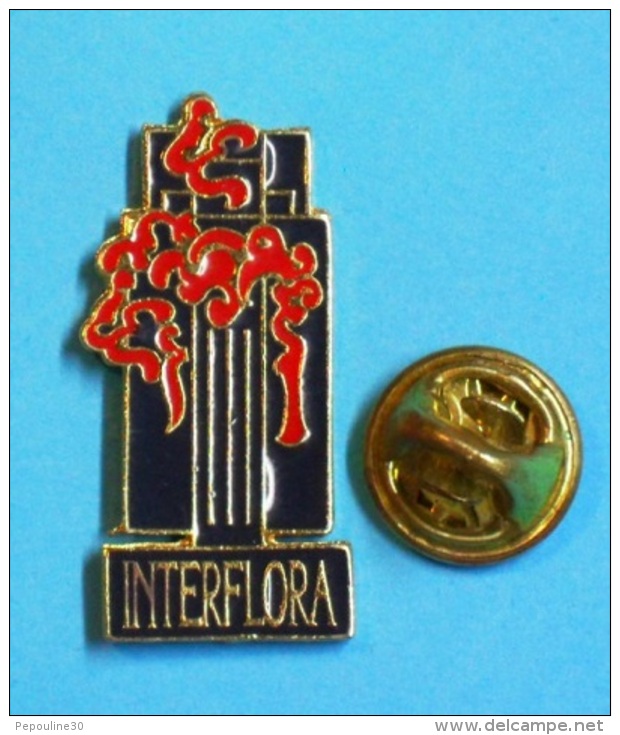 1 PIN'S  //  ** INTERFLORA ** DES FLEURS DANS LE MONDE ENTIER ** - Navidad