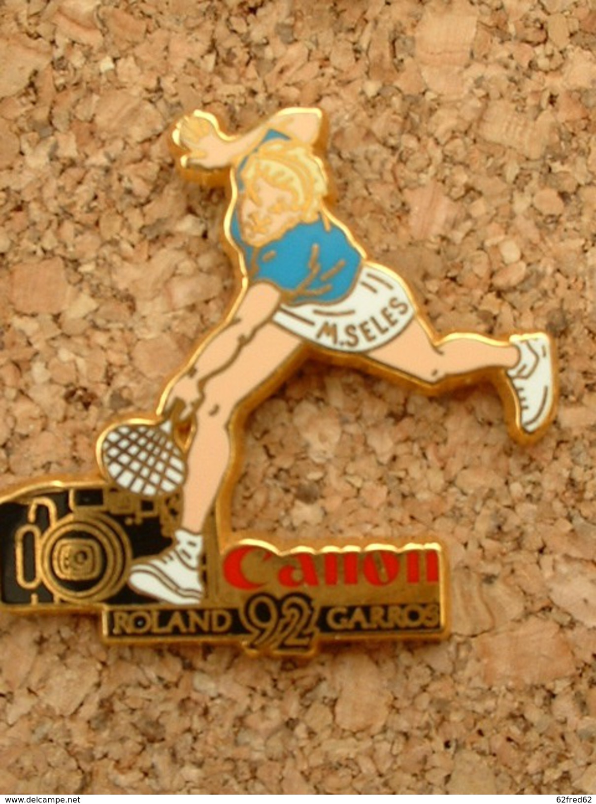 PIN'S CANON CARTOUCHE NOIR - MONICA SELES  - ROLAND GARROS 1992 - ARTHUS BERTRAND - Arthus Bertrand