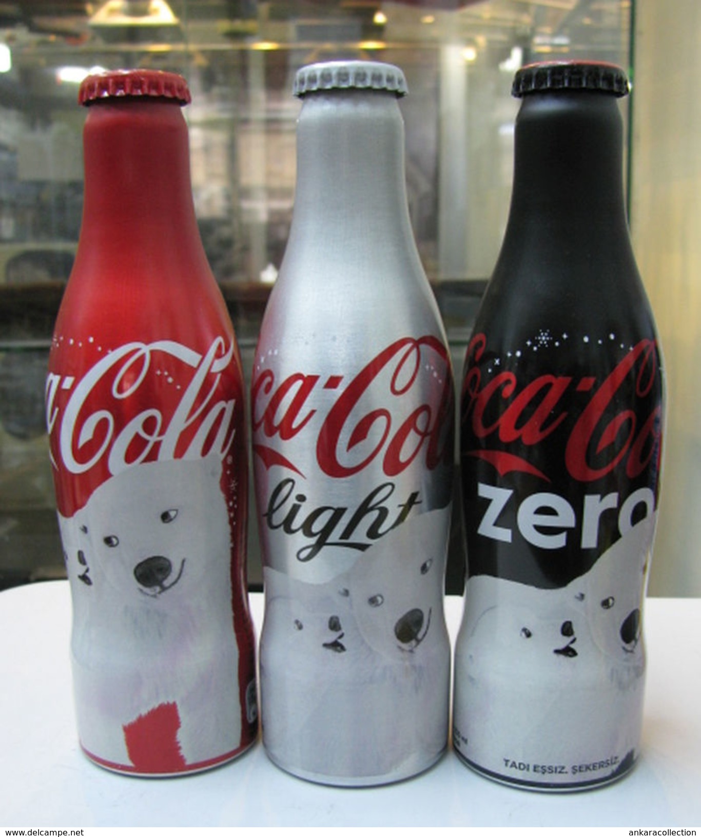 AC - COCA COLA BEAR ILLUSTRATED ALUMINUM EMPTY BOTTLES 3 PIECES SET & CROWN CAPS - Bottles