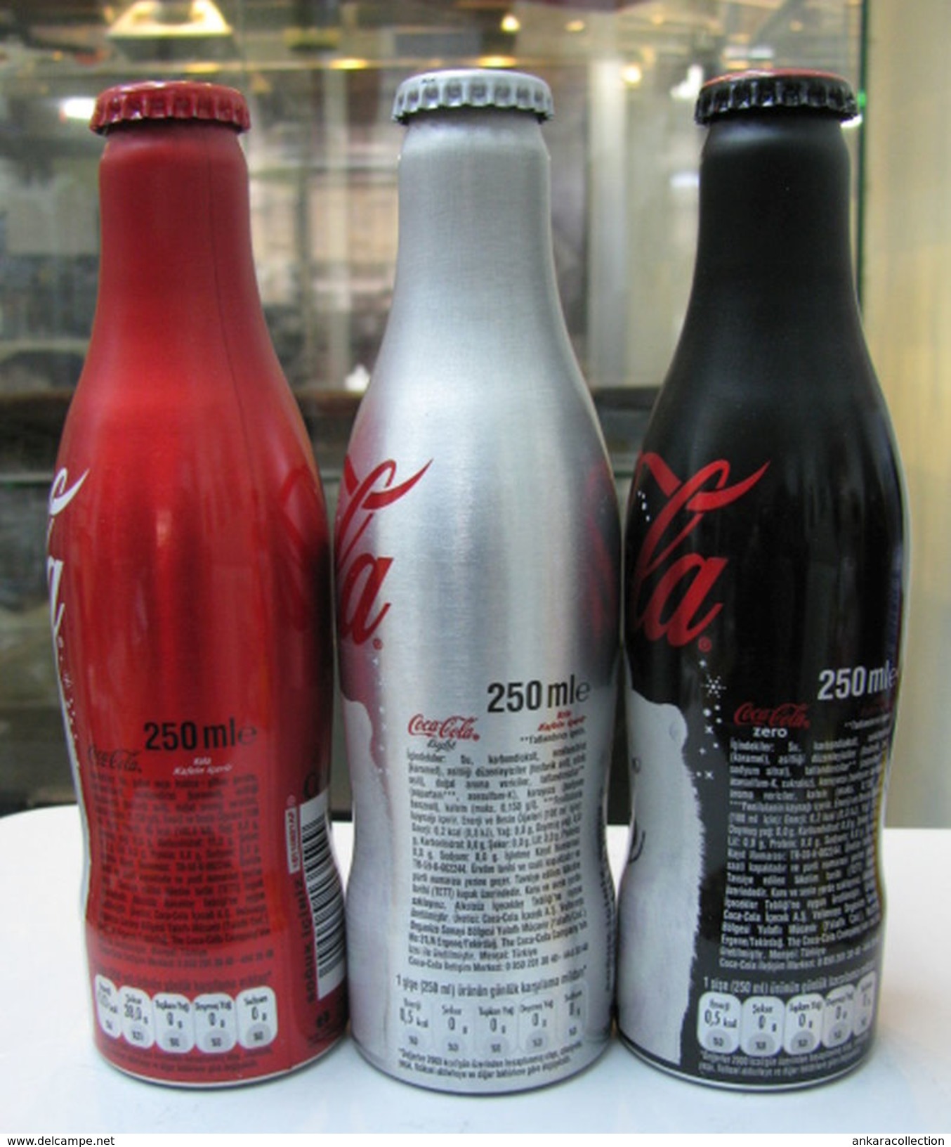 AC - COCA COLA BEAR ILLUSTRATED ALUMINUM EMPTY BOTTLES 3 PIECES SET & CROWN CAPS - Bottiglie