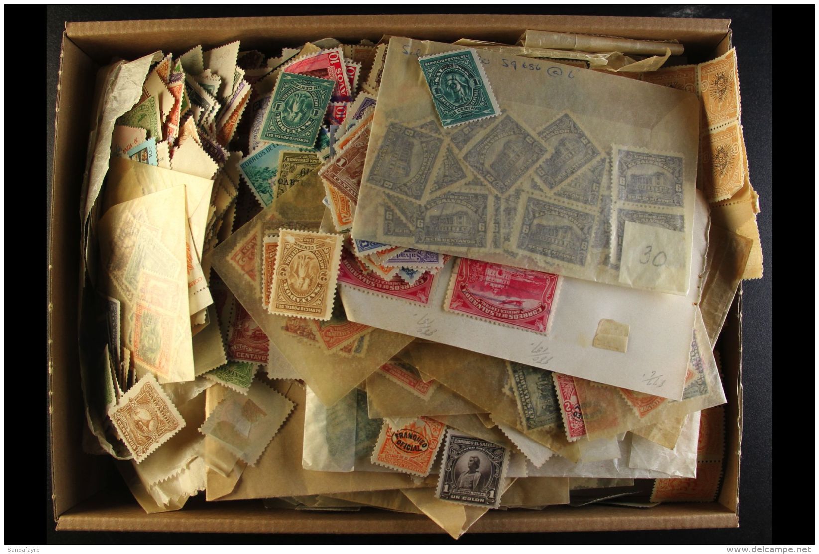 OLD TIME ASSORTMENT IN A CARTON An Unchecked Mint And Used Assembly With Stamps Stuffed Into Glassine Packets And... - Salvador