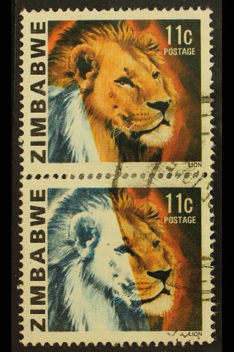 8128 1980 LION 11C - IMPRESSIVE MISSING COLOUR PAIR 11c Lion, SG 582, Vertical Pair, Showing Large Area Of Colours Missi - Zimbabwe (1980-...)