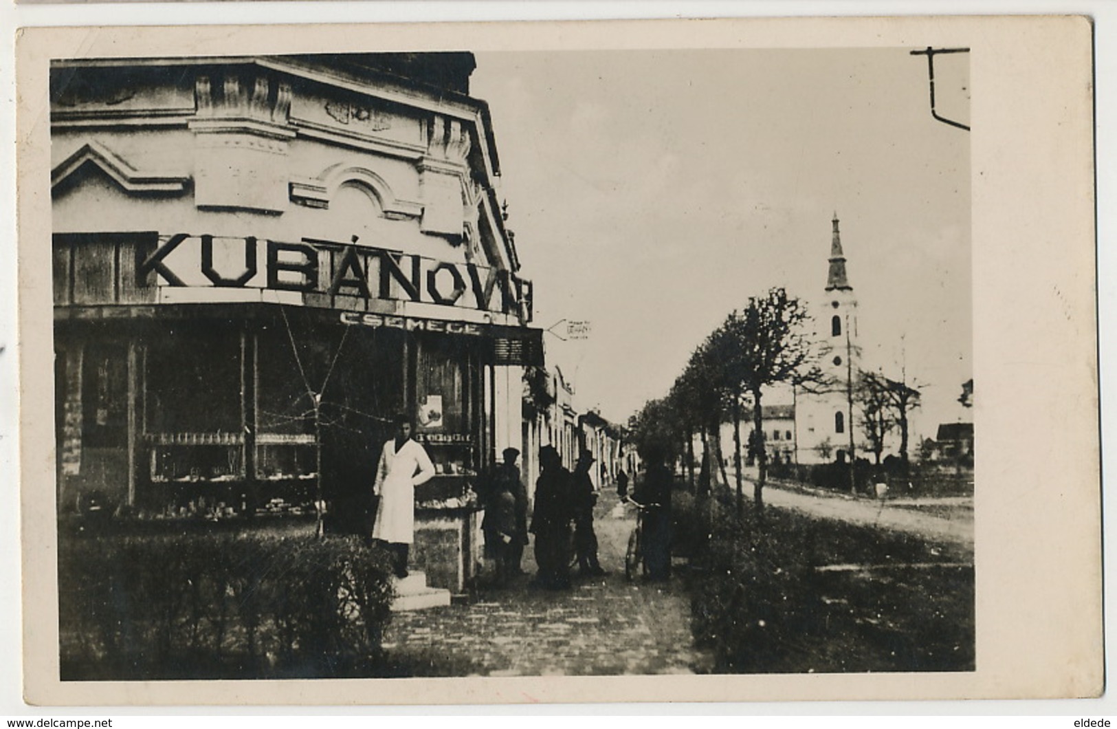 Real Photo Udvozlet Bacsrol Utcareszlet A Rom. Kath. Templommat Es Kubanovits Uzlettel Tax Belgrad - Hongrie