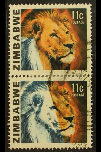 1980 LION 11C - IMPRESSIVE MISSING COLOUR PAIR  11c Lion, SG 582, Vertical Pair, Showing Large Area Of Colours Missing,  - Zimbabwe (1980-...)