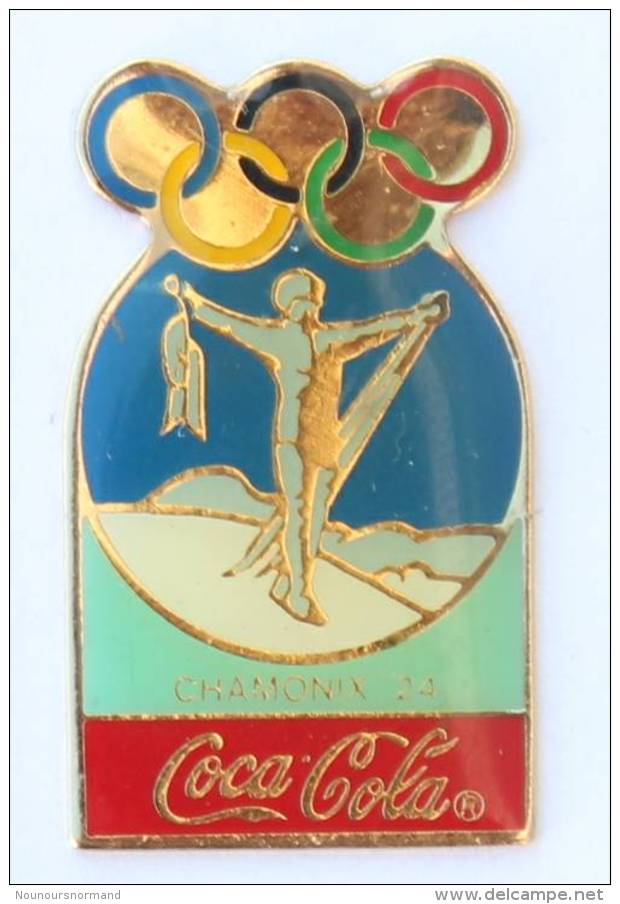 Pin's COCA COLA - 1° J.O D'hiver CHAMONIX 1924 - Homme Bras En Croix - Anneaux Olympiques - G1067 - Coca-Cola