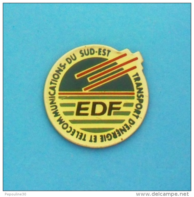 1 PIN'S  //   ** EDF ** TRANSPORT D'ENERGIE ET TELECOMMUNICATION ** DU SUD-EST ** - EDF GDF