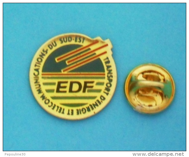 1 PIN'S  //   ** EDF ** TRANSPORT D'ENERGIE ET TELECOMMUNICATION ** DU SUD-EST ** - EDF GDF