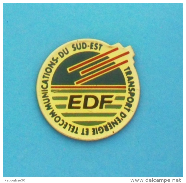 1 PIN'S  //   ** EDF ** TRANSPORT D'ENERGIE ET TELECOMMUNICATION ** DU SUD-EST ** - EDF GDF