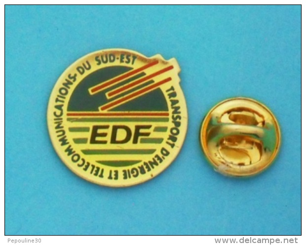 1 PIN'S  //   ** EDF ** TRANSPORT D'ENERGIE ET TELECOMMUNICATION ** DU SUD-EST ** - EDF GDF