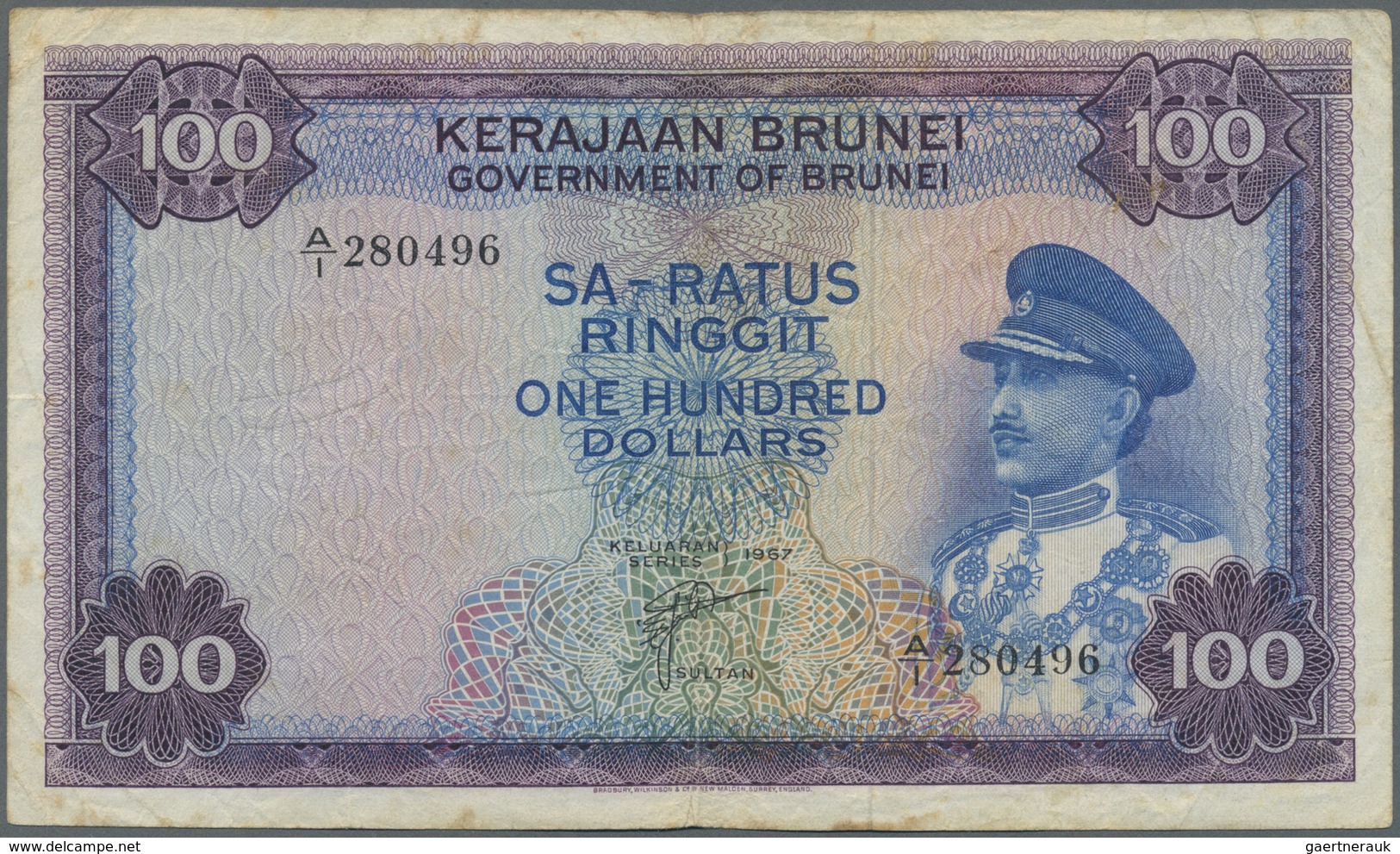 Brunei: 100 Ringgit 1967 P. 5, Used With Several Folds And Creases, Stained Paper, No Holes Or Tears - Brunei