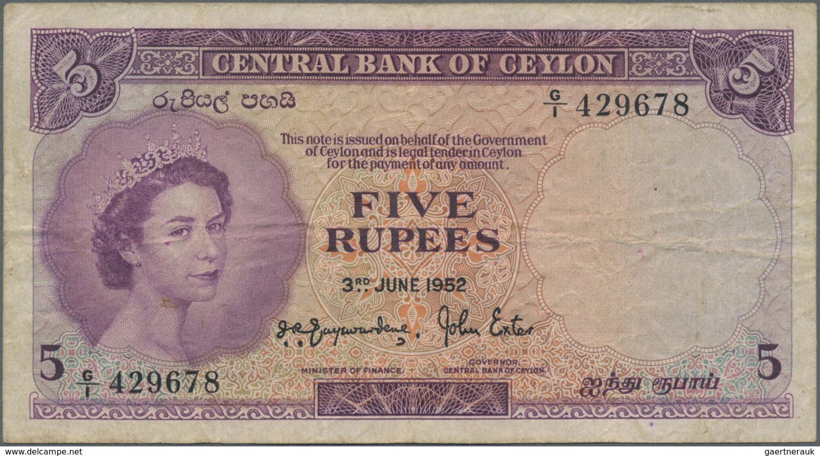 Ceylon: 5 Rupees 1952 With Prefix G/1, P.52, Lightly Stained Paper With Several Folds. Condition: F - Sri Lanka