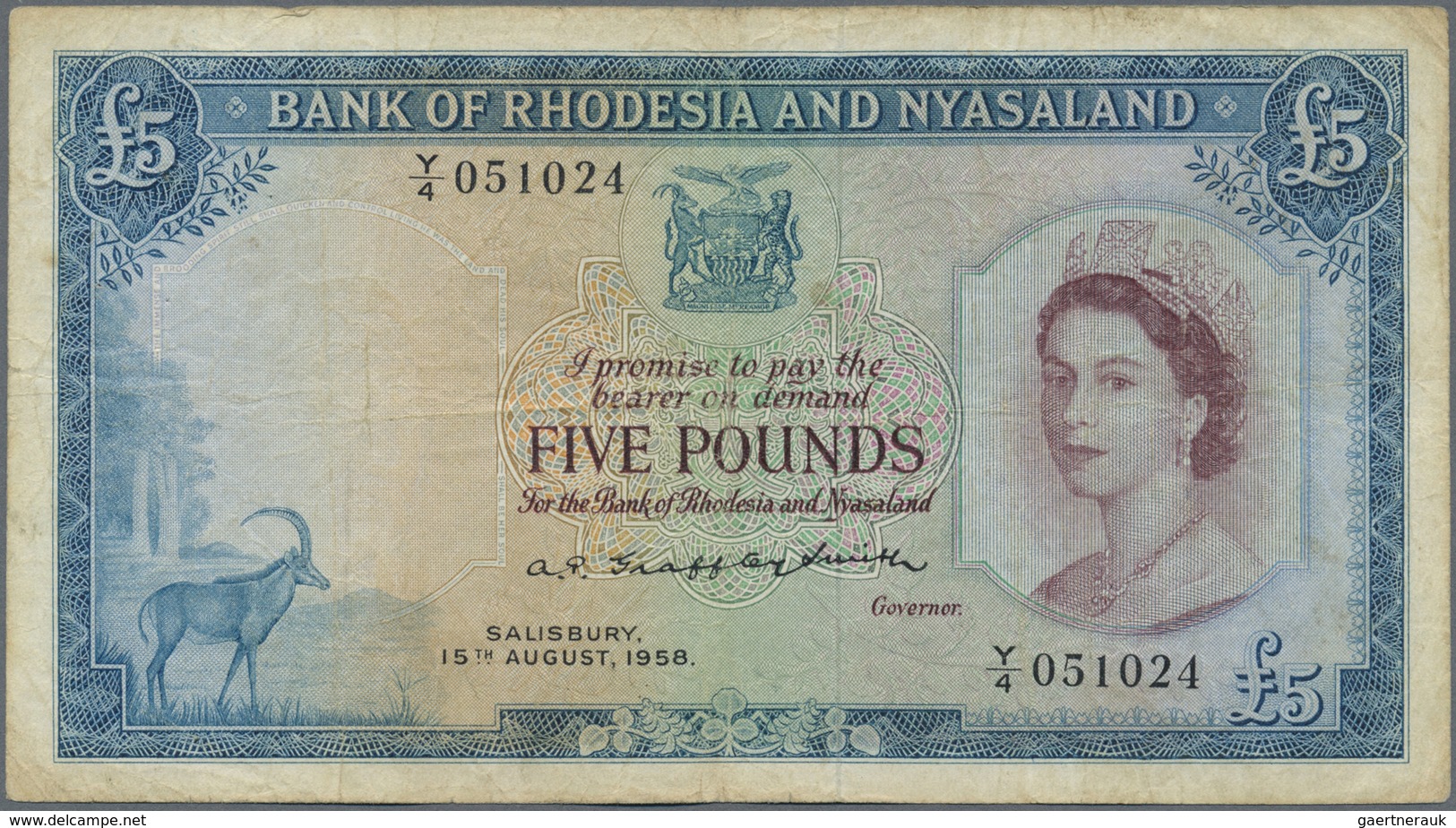 Rhodesia & Nyasaland: 5 Pounds August 15th 1958, P.22a With Several Handling Traces Like Folds And S - Rhodesia