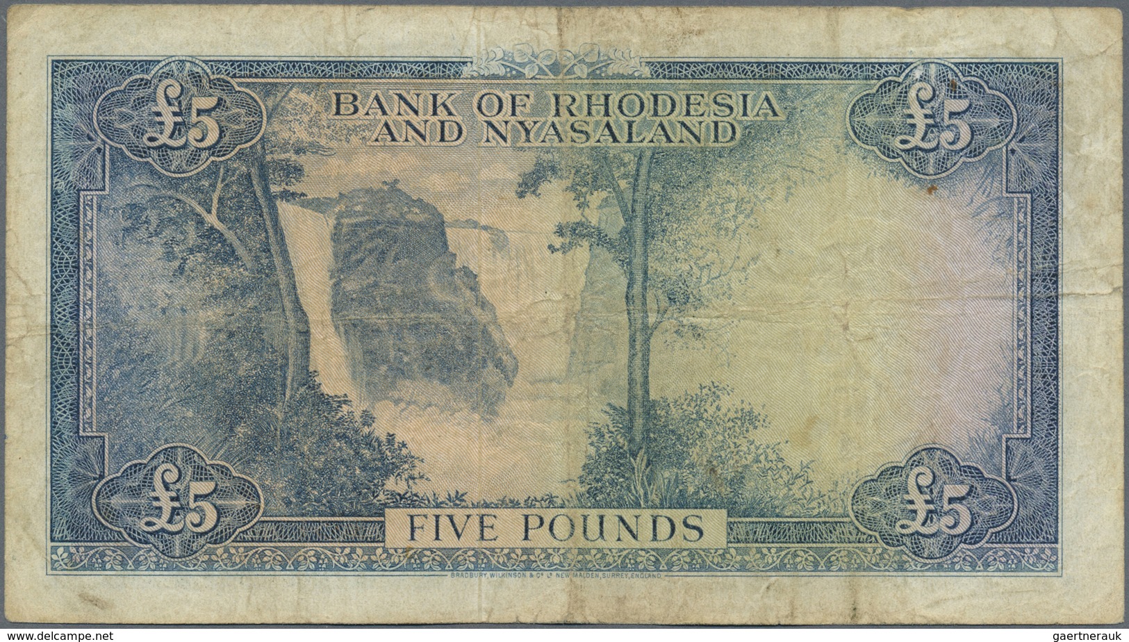 Rhodesia & Nyasaland: 5 Pounds August 15th 1958, P.22a With Several Handling Traces Like Folds And S - Rhodesien