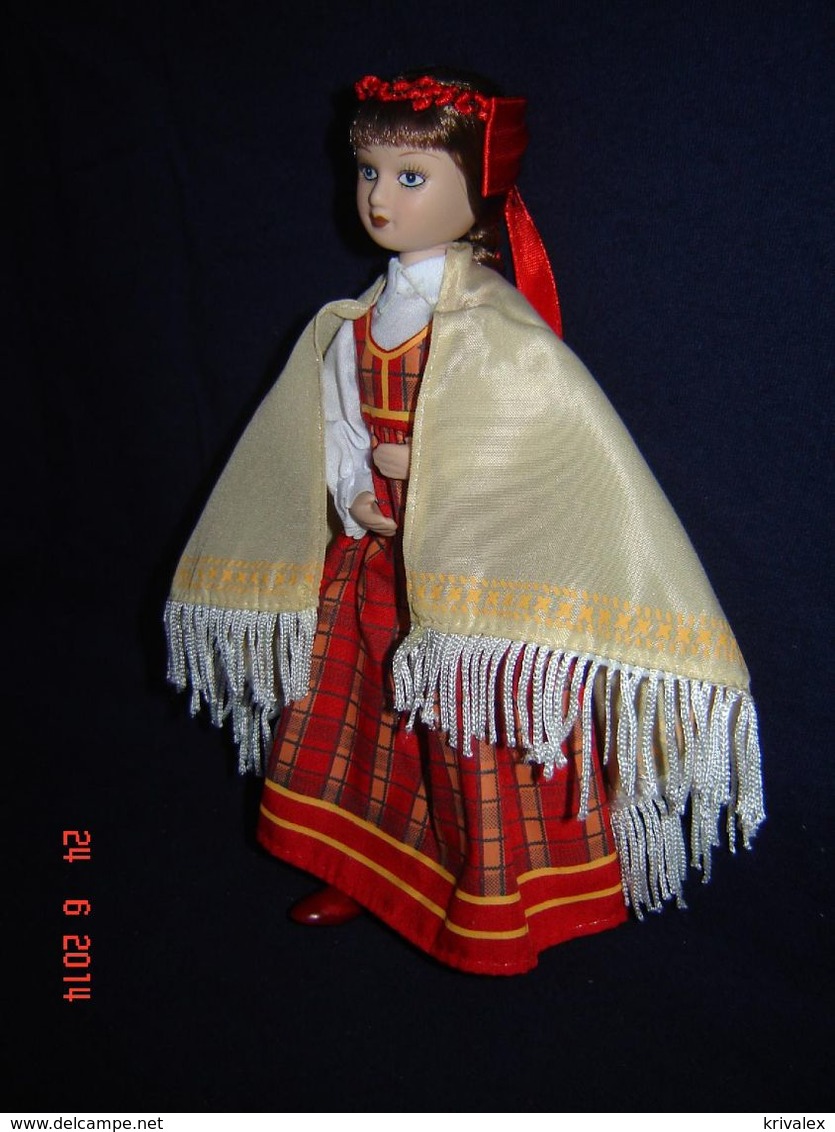 Porcelain doll in cloth dress of  Latvia Republic  - Russian Federation