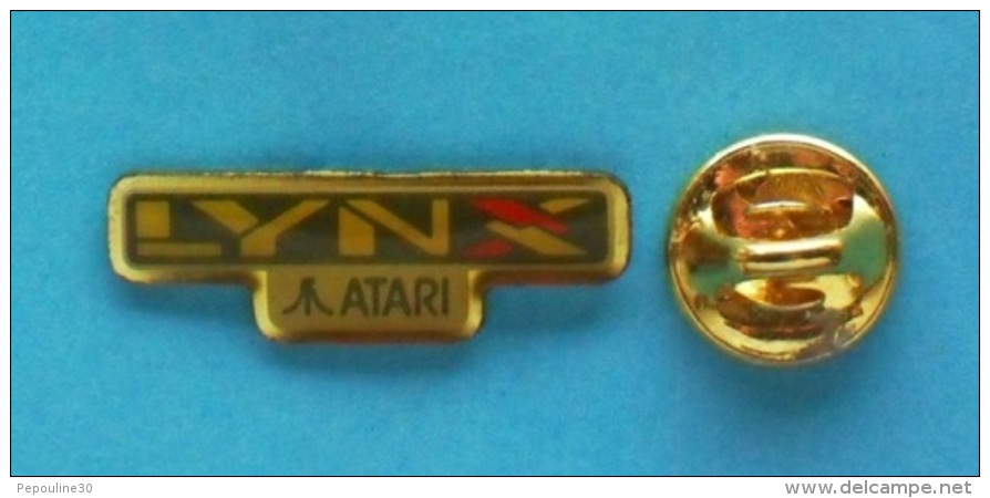 1 PIN'S //   ** CONSOLE DE JEUX VIDÉO ATARI ** LYNX ** FONDATEUR Nolan BUSHNELL ** - Computers