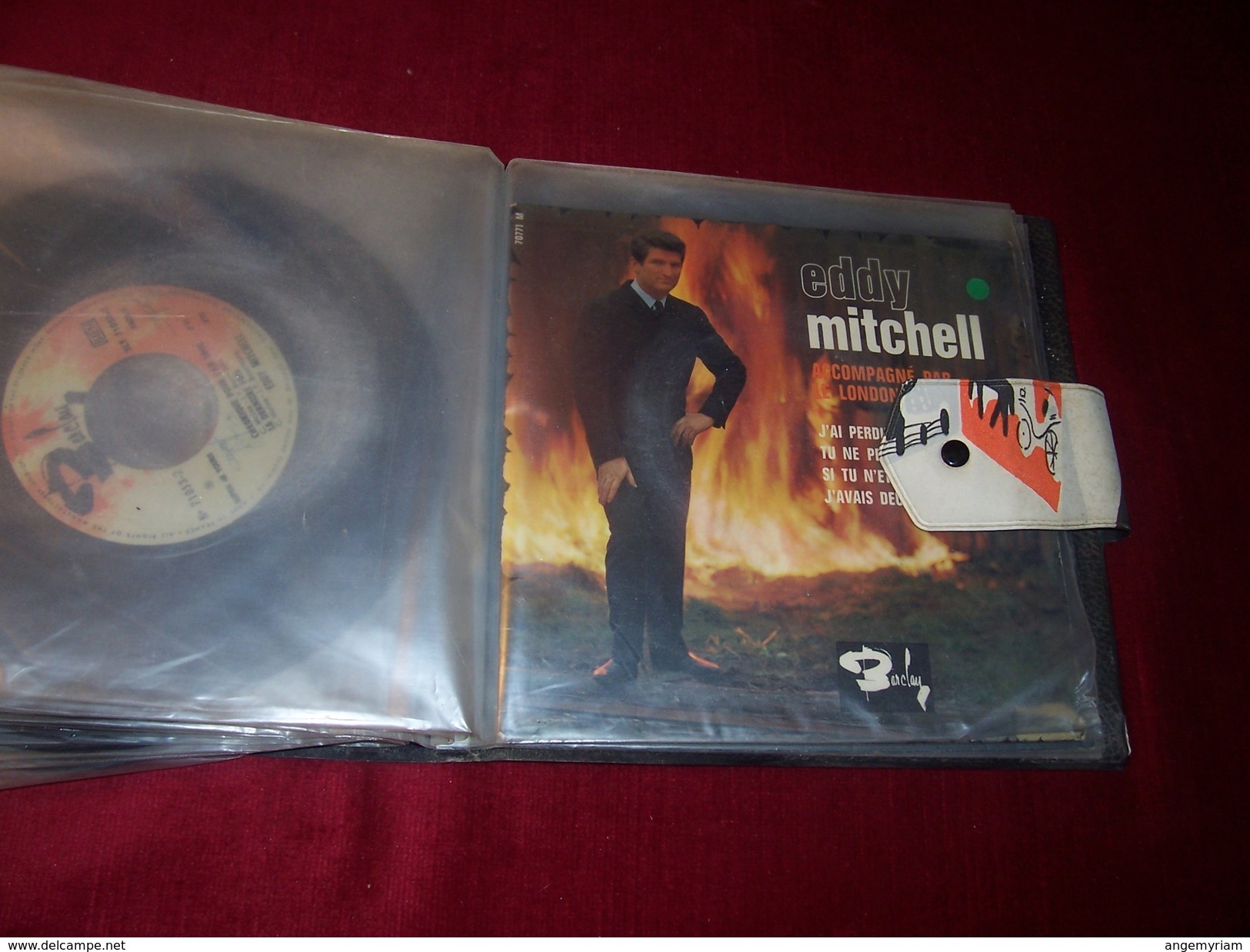 LOT  14 DISQUES  VINYLES OCCASION EN  45 TOURS DE EDDY MITCHELL  AVEC CLASSEUR