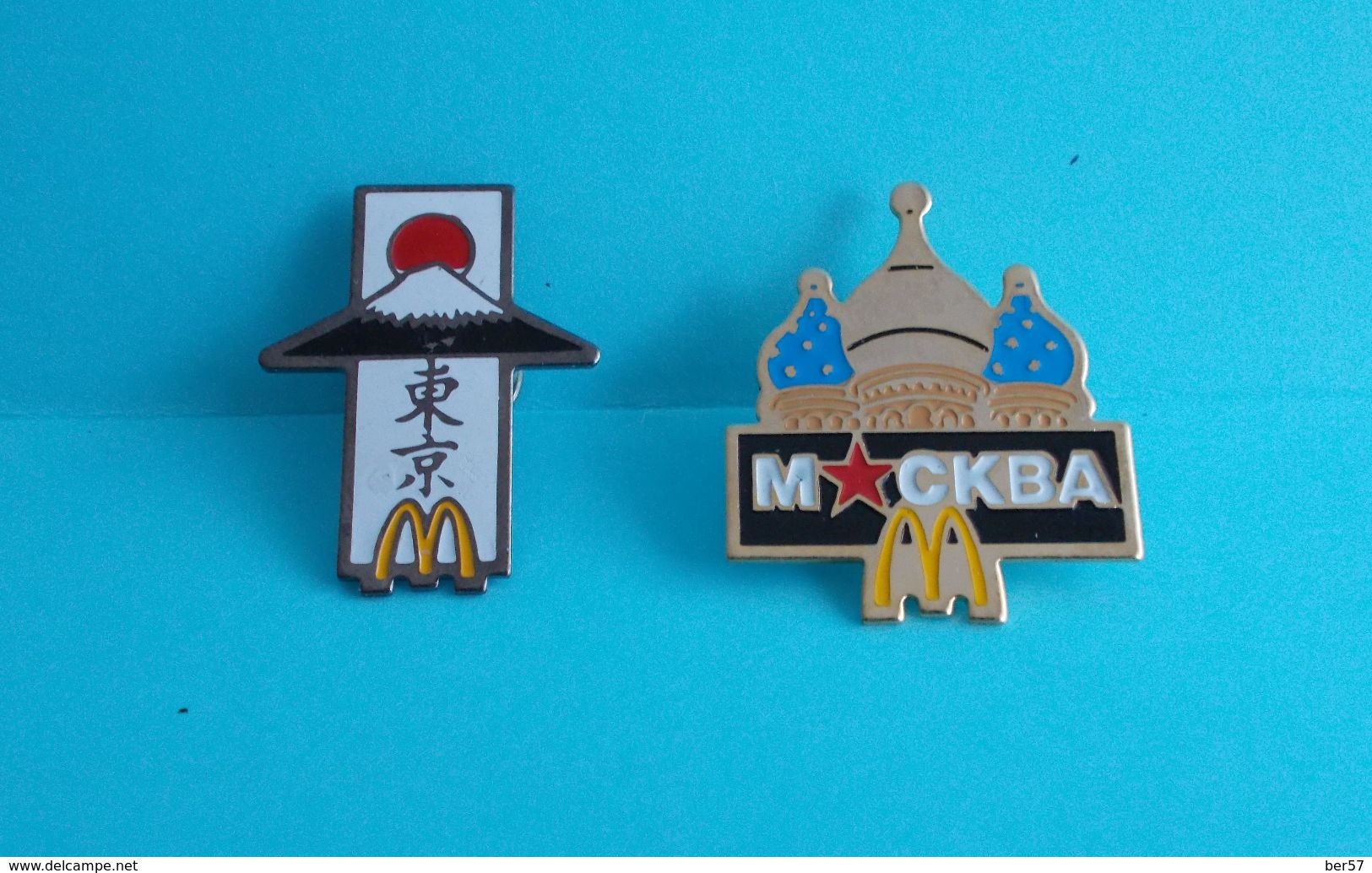 Lot De 2 Pin's Mc Donald Signés Arthus Bertrand : Moscou Et Tokyo - McDonald's