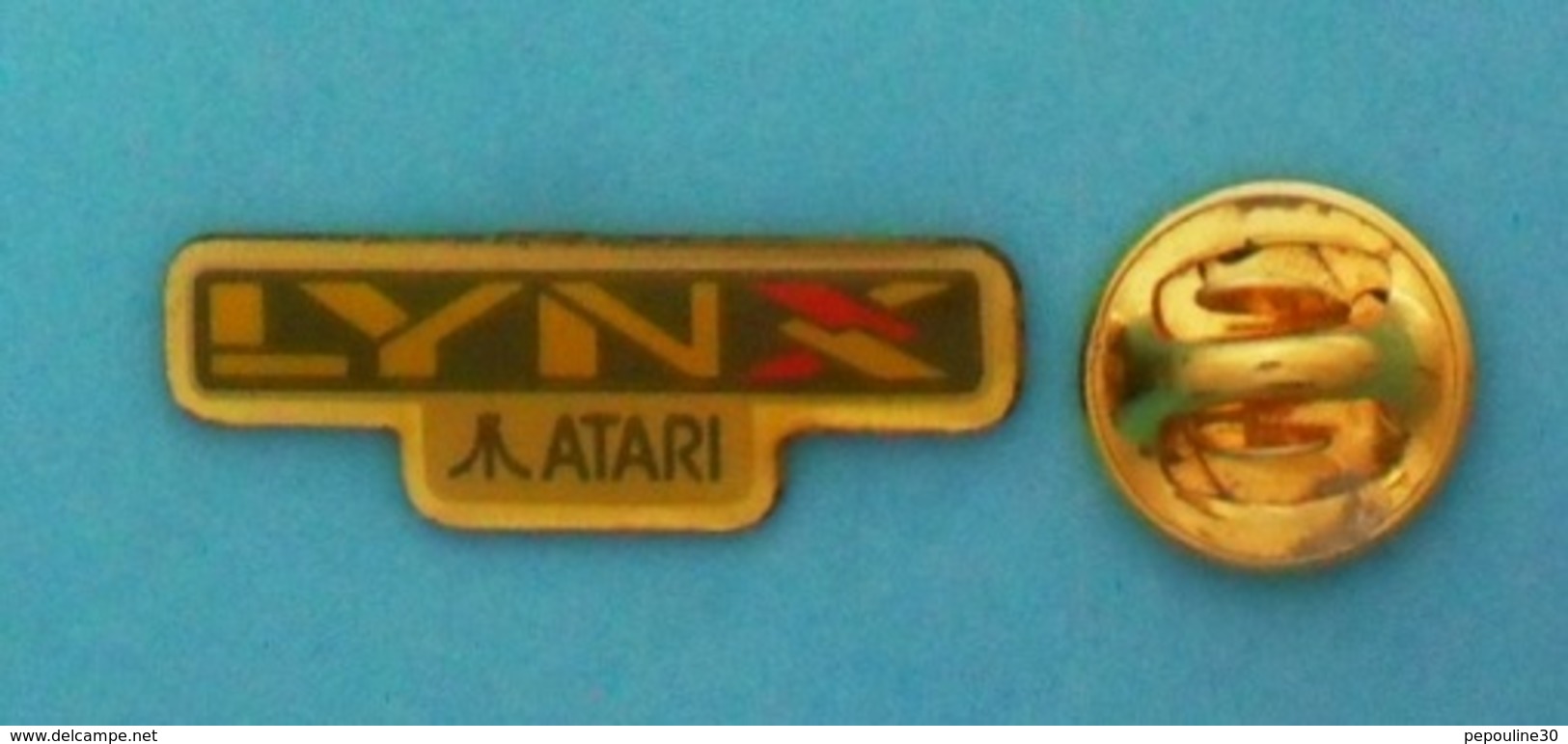 1 PIN'S //  ** CONSOLE ** DE JEUX VIDÉO ** ATARI ** LYNX ** FONDATEUR Nolan BUSHNELL ** - Jeux