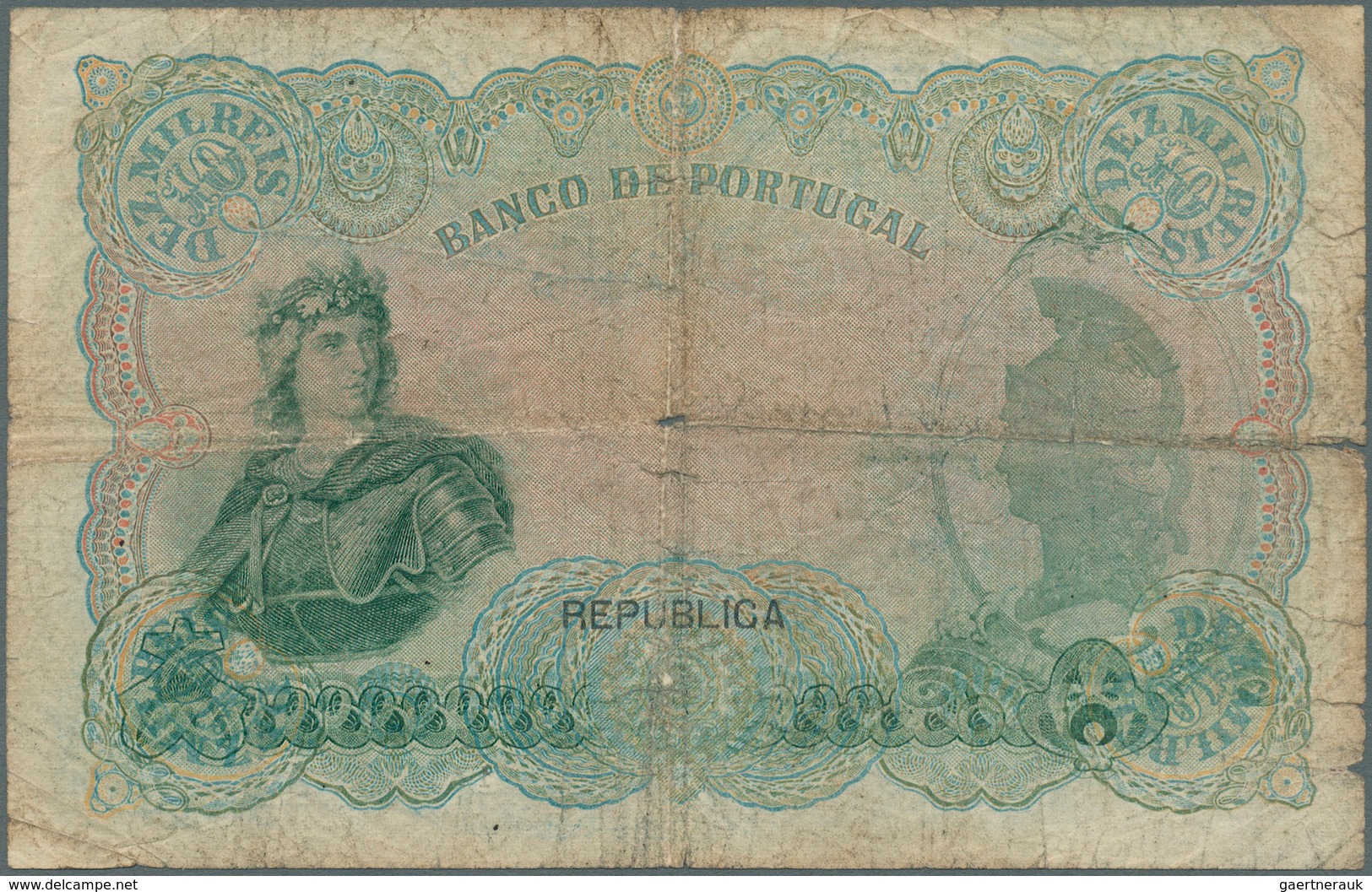 02221 Portugal: 10.000 Reis 1910 P. 108b, Well Worn Condition, 2cm Tear At Left, Center Hole And Several F - Portogallo