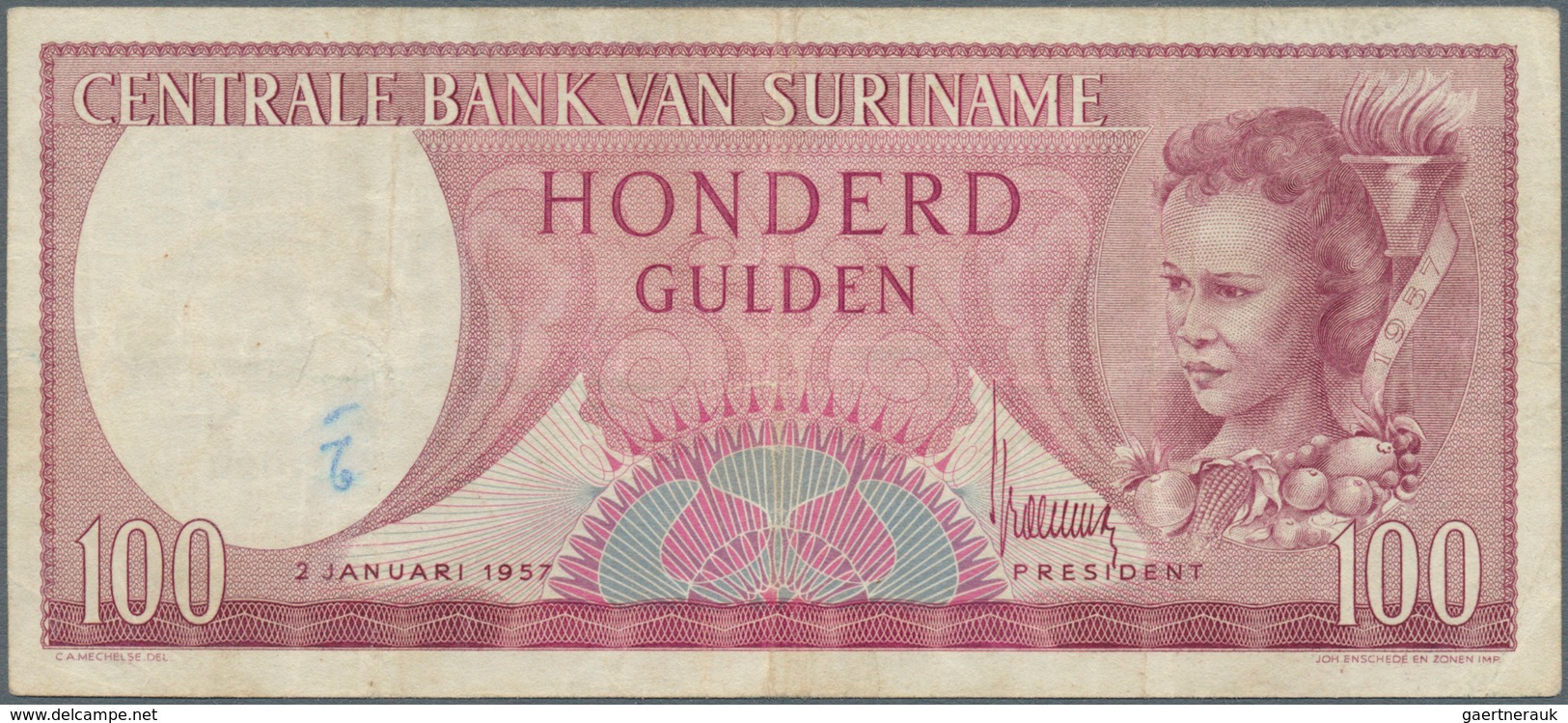 02453 Suriname: 100 Gulden 1957 P. 114, Used With Folds And Stain In Paper, Pressed, Condition: F. - Suriname