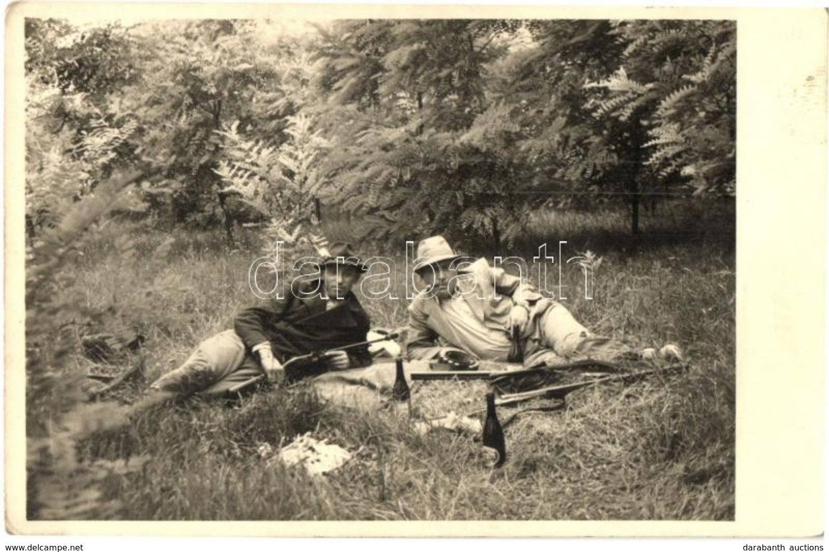 ** T2 Hunters With Guns And Beer. Photo - Unclassified