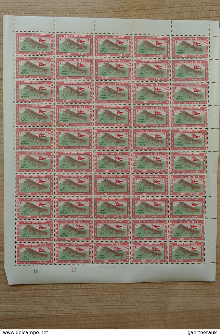 23700 Nepal: Box with ca. 65, mostly complete, MNH sheets of Nepal, including some nice thematic material.