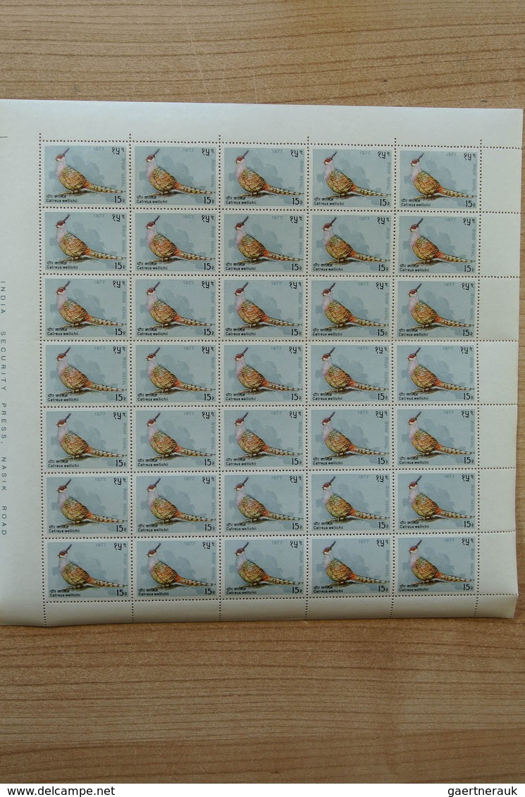 23700 Nepal: Box with ca. 65, mostly complete, MNH sheets of Nepal, including some nice thematic material.