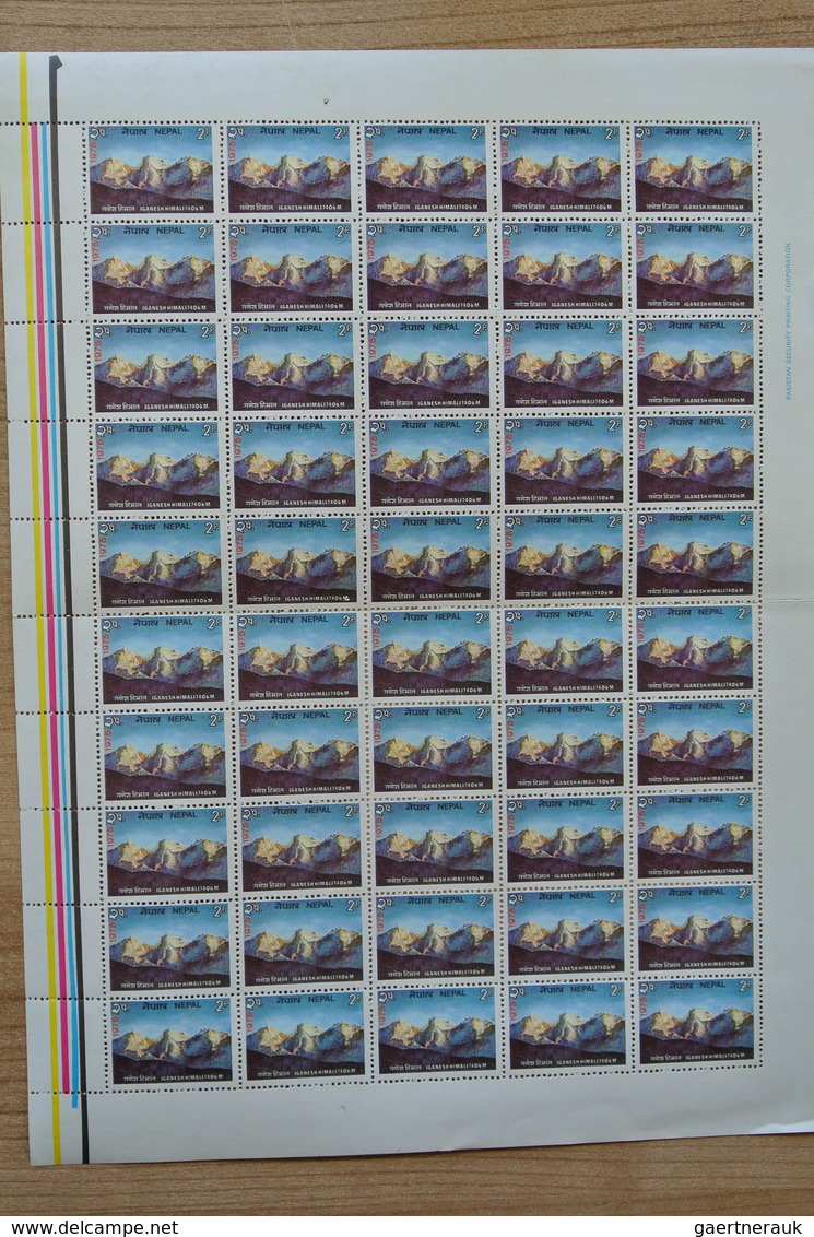 23700 Nepal: Box with ca. 65, mostly complete, MNH sheets of Nepal, including some nice thematic material.