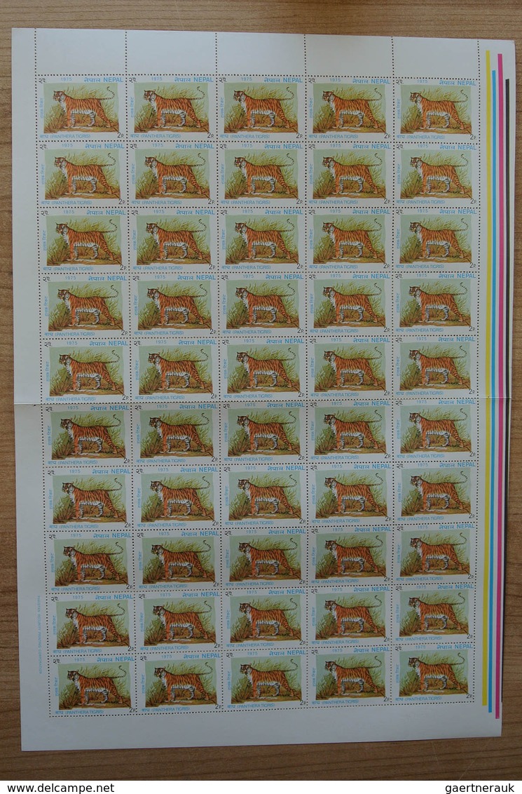 23700 Nepal: Box with ca. 65, mostly complete, MNH sheets of Nepal, including some nice thematic material.