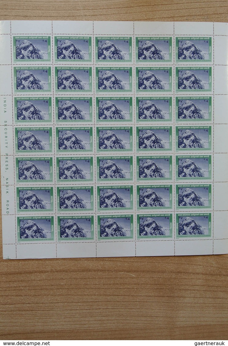 23700 Nepal: Box with ca. 65, mostly complete, MNH sheets of Nepal, including some nice thematic material.