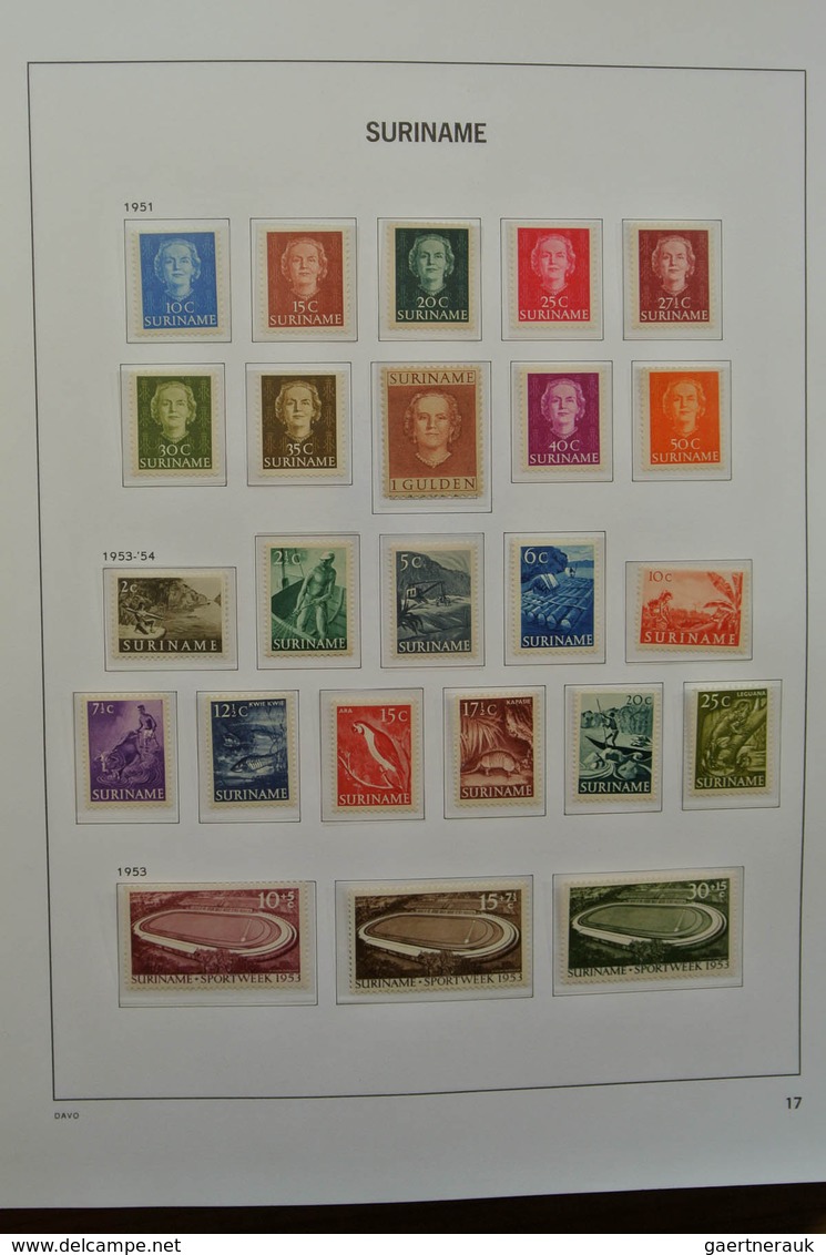 24151 Surinam: 1873-1975. Nicely filled, MNH, mint hinged and used collection Surinam in Davo luxe album.