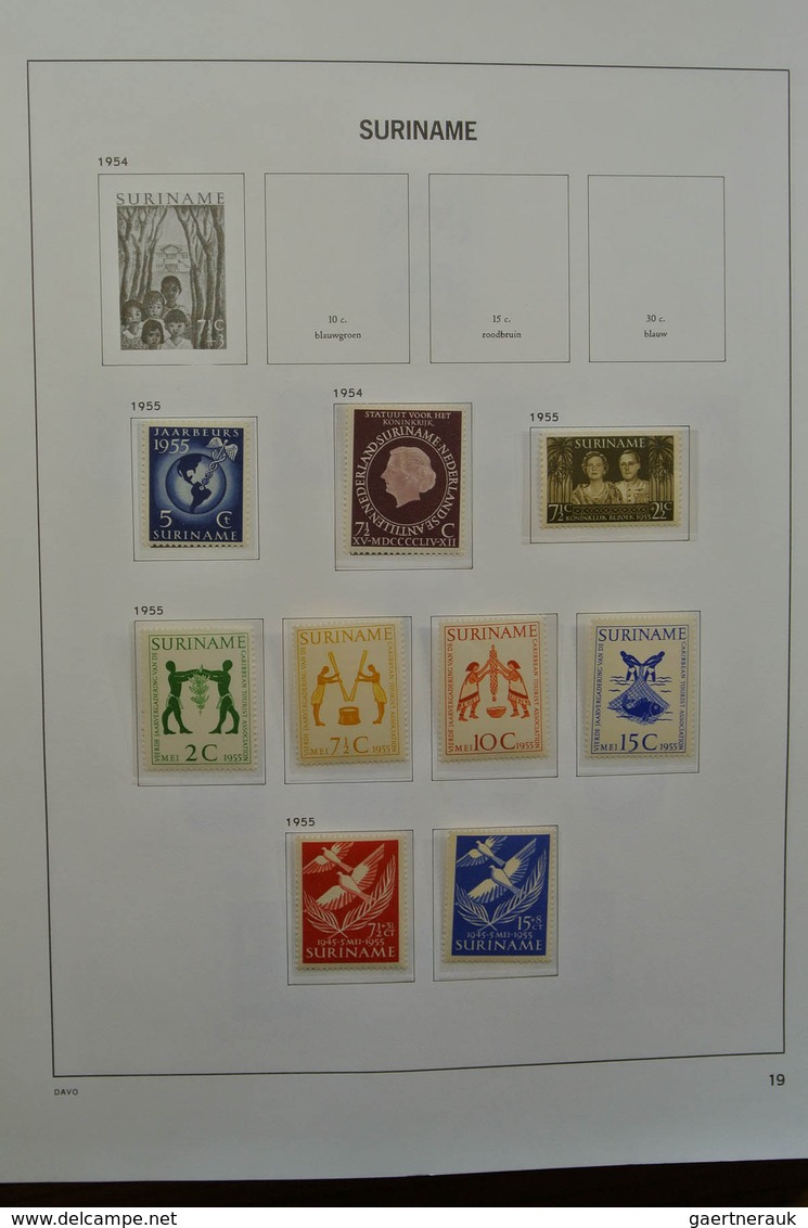 24151 Surinam: 1873-1975. Nicely filled, MNH, mint hinged and used collection Surinam in Davo luxe album.