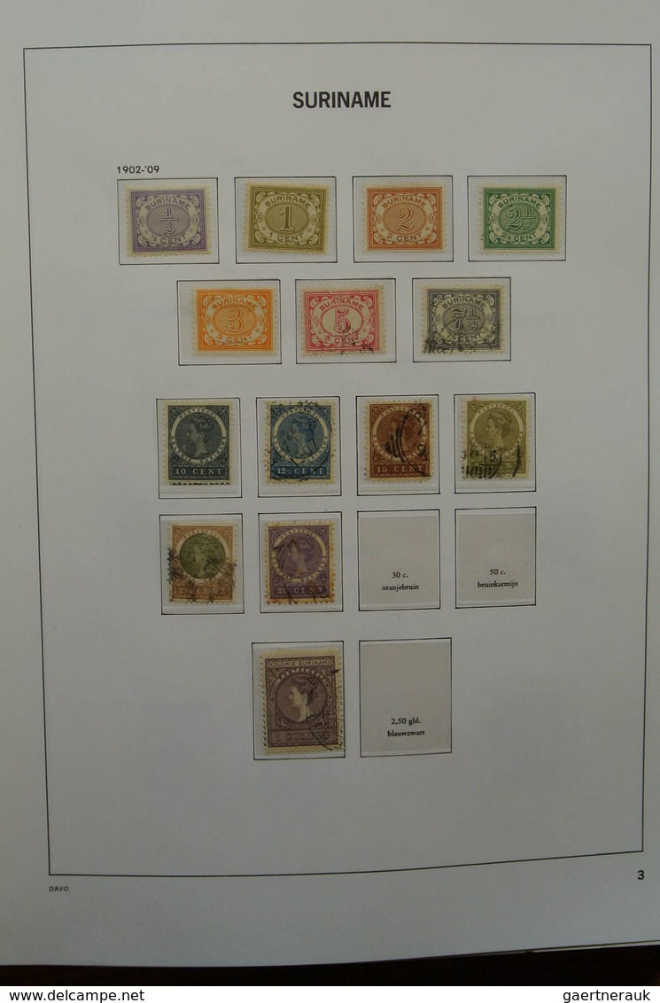 24151 Surinam: 1873-1975. Nicely filled, MNH, mint hinged and used collection Surinam in Davo luxe album.