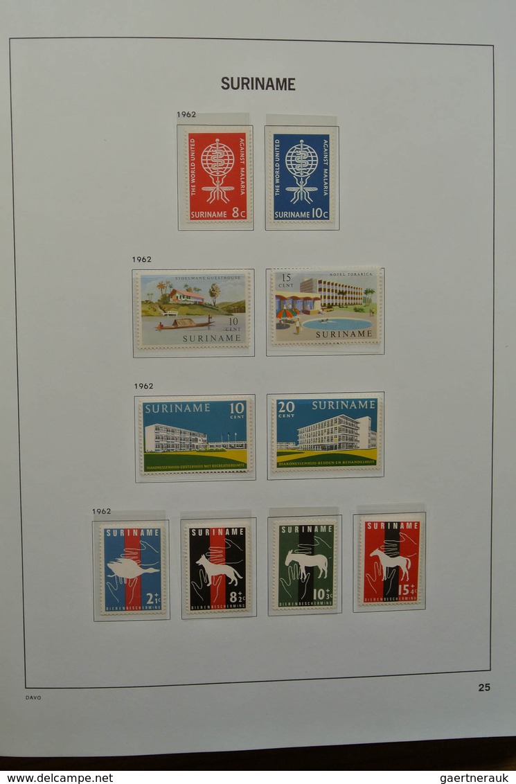 24151 Surinam: 1873-1975. Nicely filled, MNH, mint hinged and used collection Surinam in Davo luxe album.