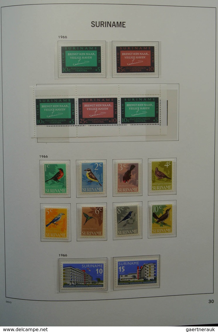 24151 Surinam: 1873-1975. Nicely filled, MNH, mint hinged and used collection Surinam in Davo luxe album.