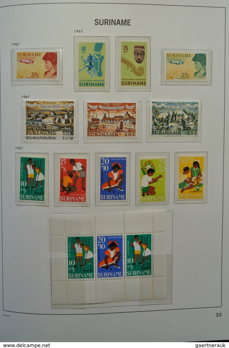 24151 Surinam: 1873-1975. Nicely filled, MNH, mint hinged and used collection Surinam in Davo luxe album.