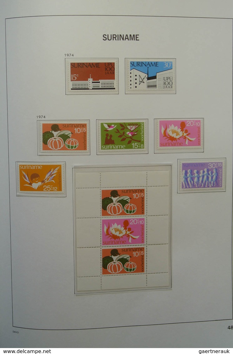 24151 Surinam: 1873-1975. Nicely filled, MNH, mint hinged and used collection Surinam in Davo luxe album.