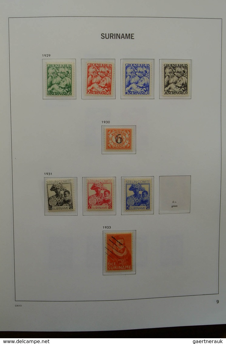 24151 Surinam: 1873-1975. Nicely filled, MNH, mint hinged and used collection Surinam in Davo luxe album.