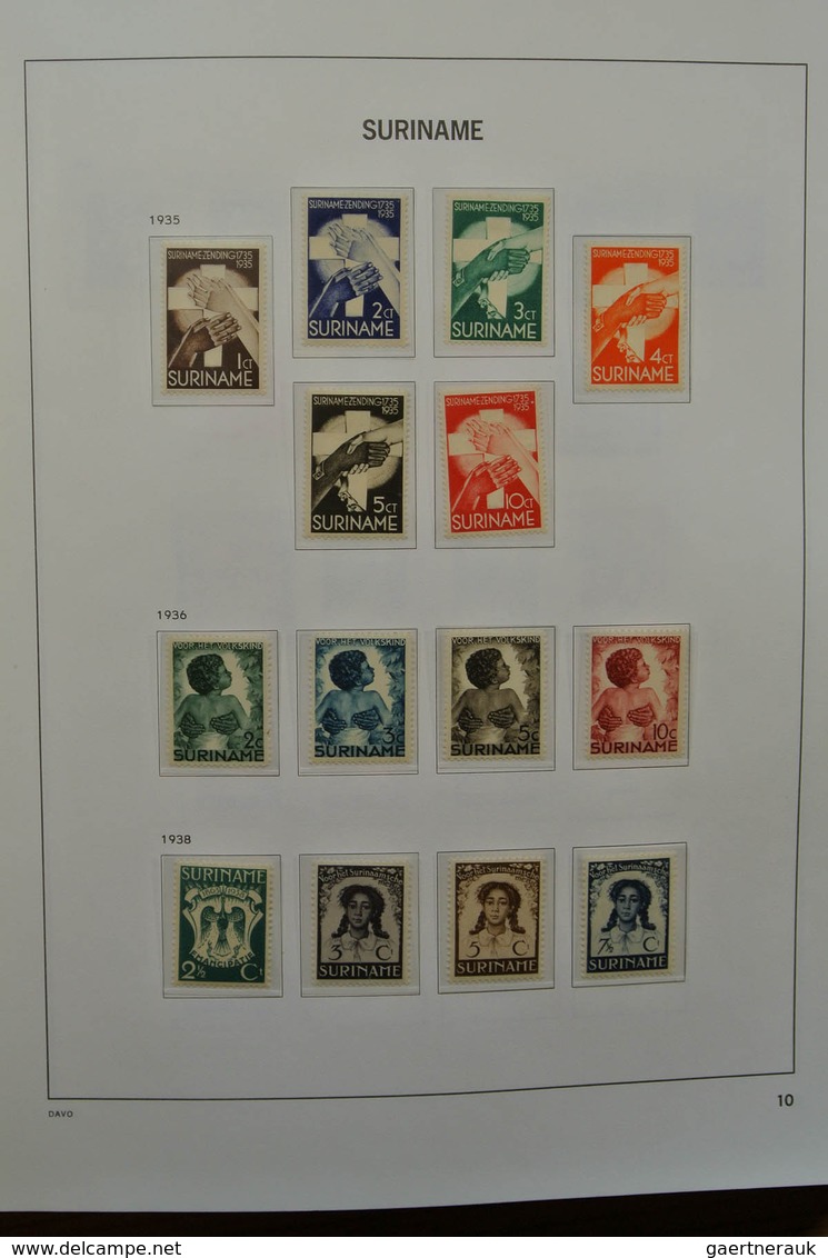 24151 Surinam: 1873-1975. Nicely filled, MNH, mint hinged and used collection Surinam in Davo luxe album.