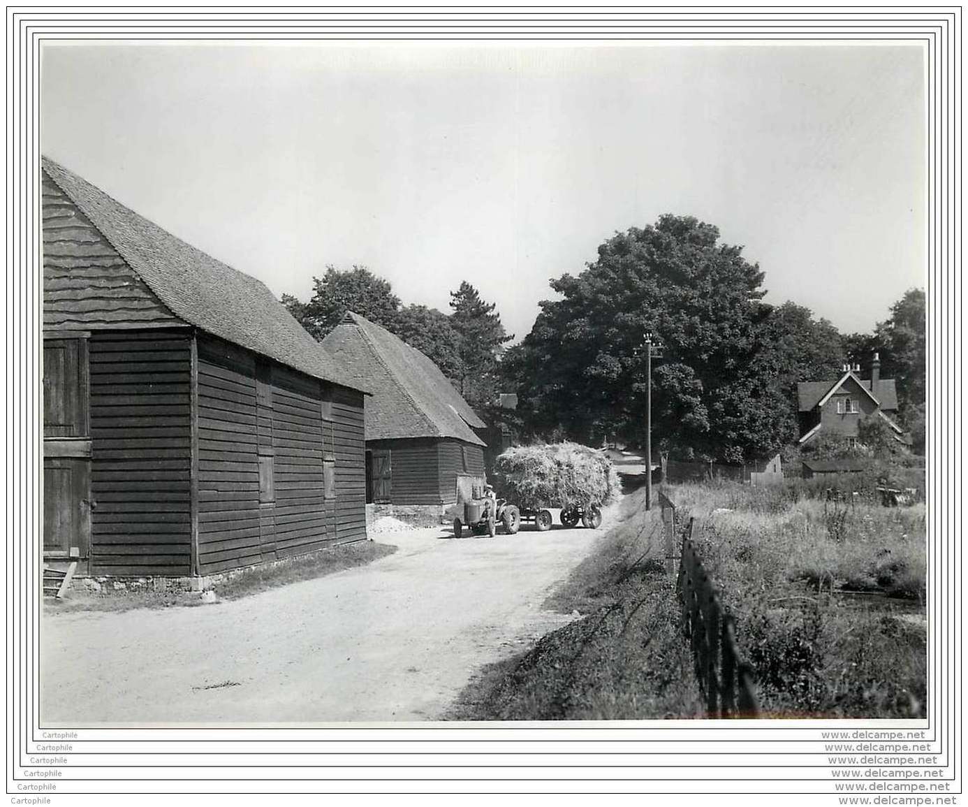 Press Photo - UK - Wanborough - Modern Tractor And Centuries-old Barns - 1945 - Lieux