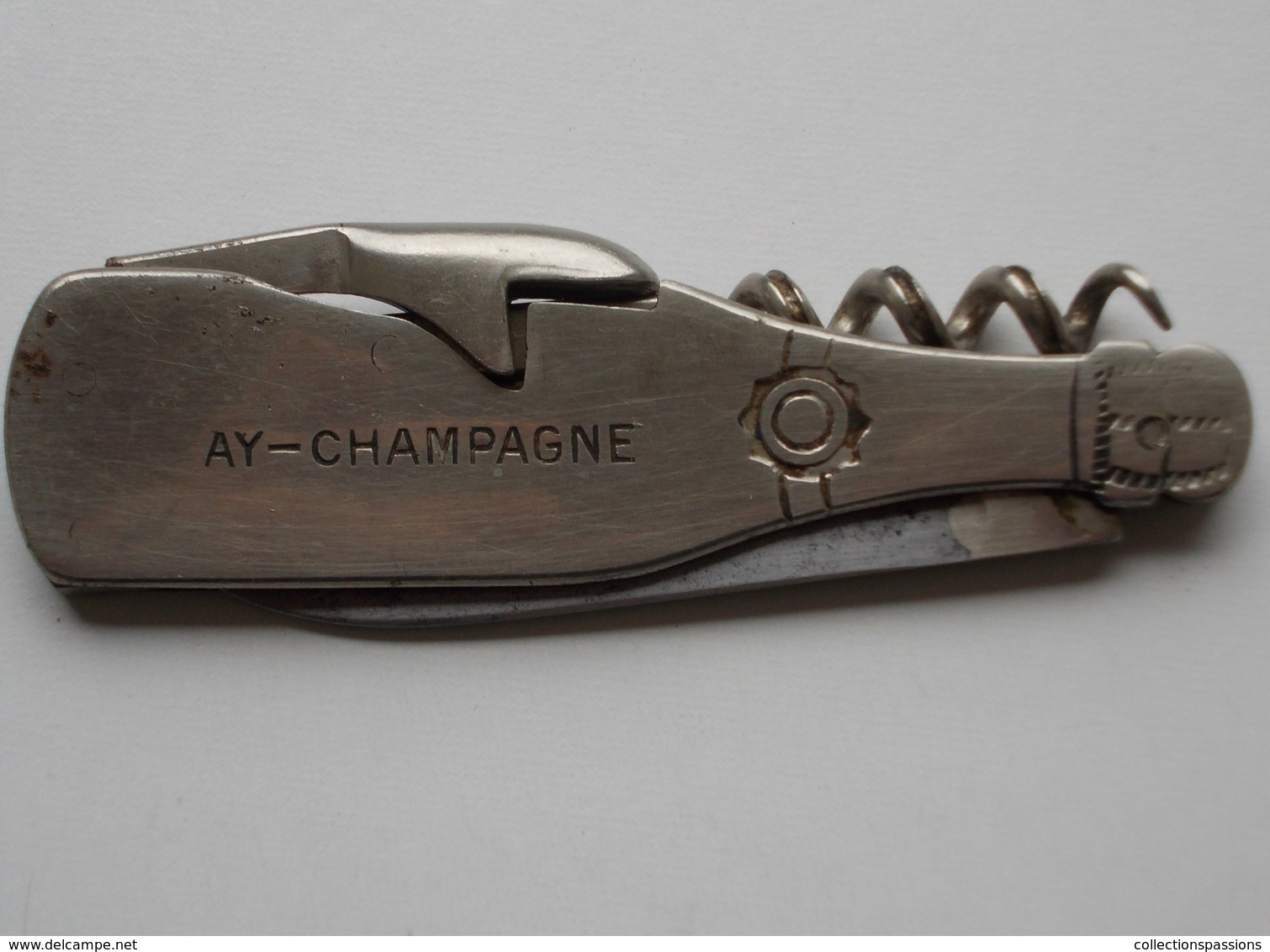 - LIMONADIER - AY. CHAMPAGNE René Brun - En Forme De Bouteille - - Bottle Openers