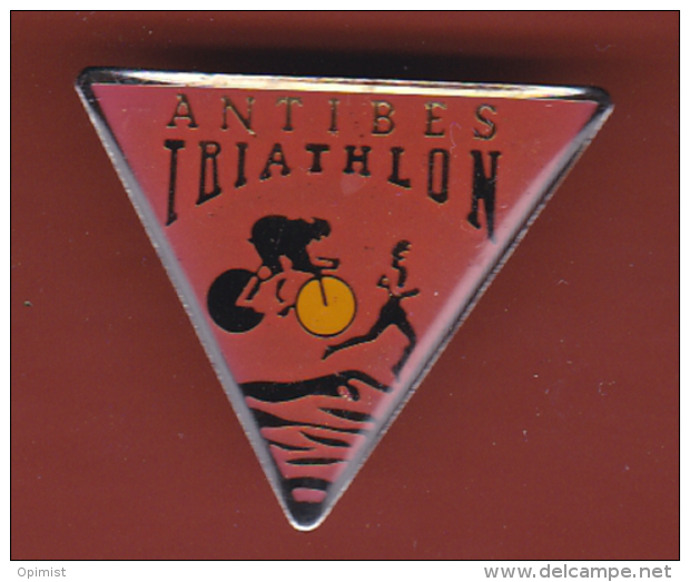 53350- Pin's.Antibes Triathlon.cyclisme.natation.athletisme.course. - Biathlon