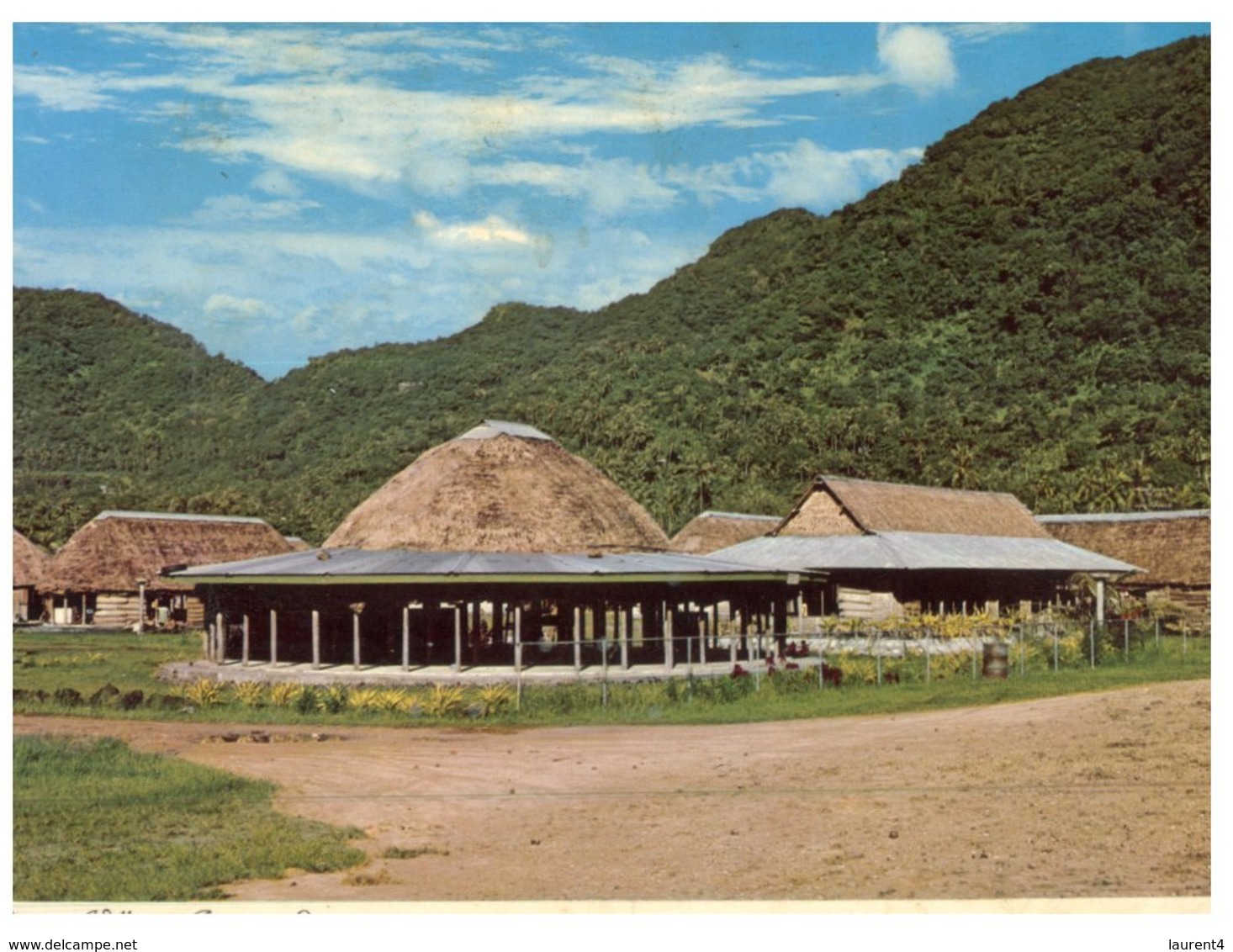 (215) American Samoa To Australia Postcard - Modern Native Village (but Posted With Tonga Stamps) - Samoa Americana