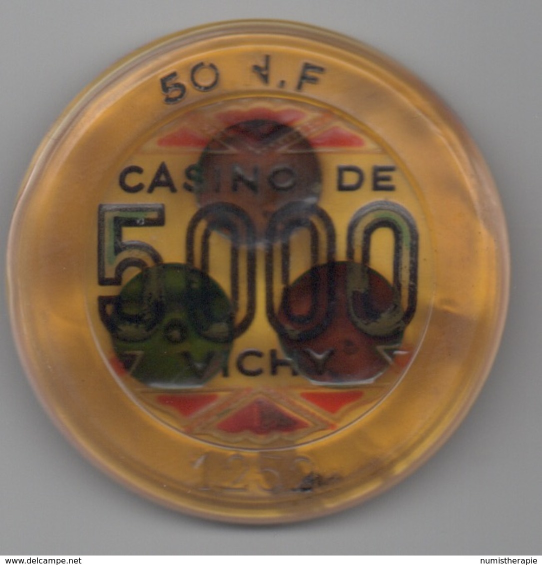 Jeton De Casino De Vichy 5000F=50NF (Fortement Déformé - Détérioration âgée ?) - Casino