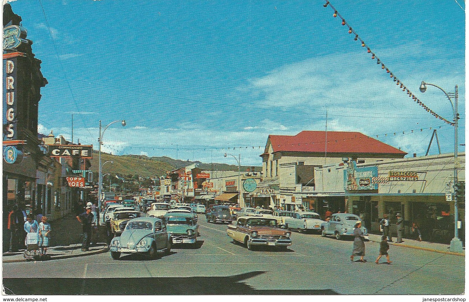 KAMLOOPS - B.C. A VIEW OF MAIN STREET SHOWING VW BEETLE, MORRIS MINOR ETC.  GUESS 1960's - Kamloops