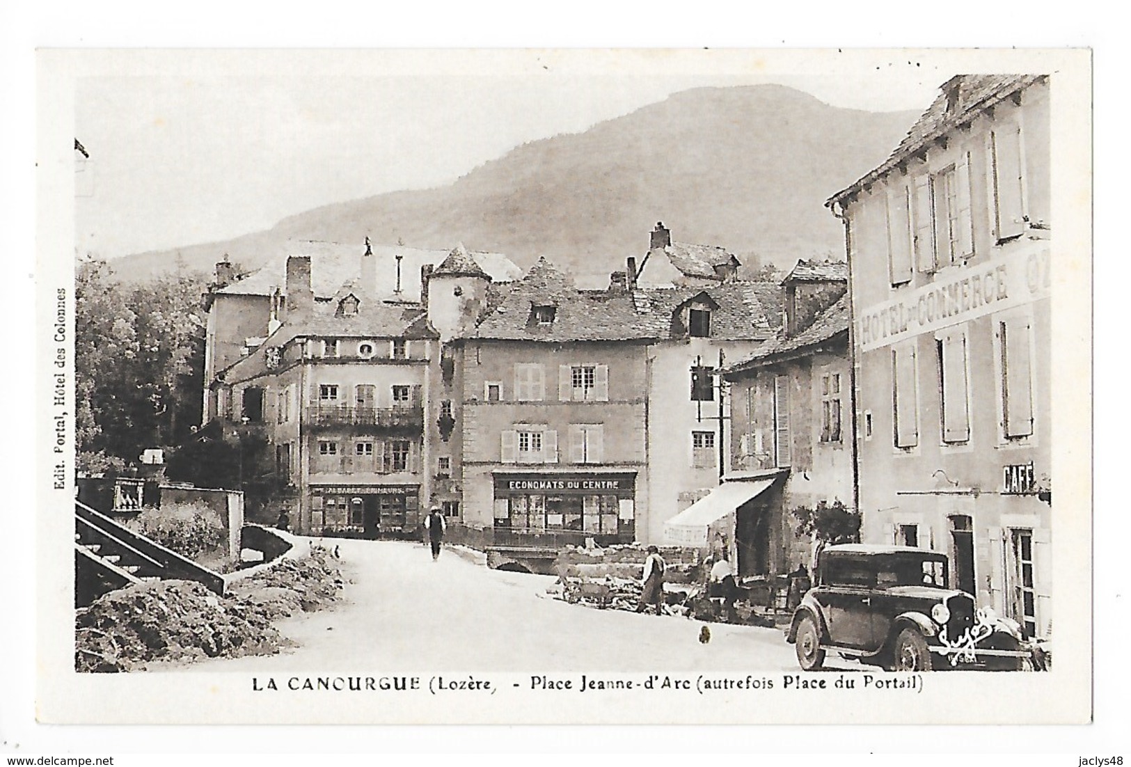 LA CANOURGUE  (cpa 48)  Place Jeanne D'Arc, Hôtel Du Commerce, ALBARET Primeurs, Economats Du Centre  -  L 1 - Other & Unclassified