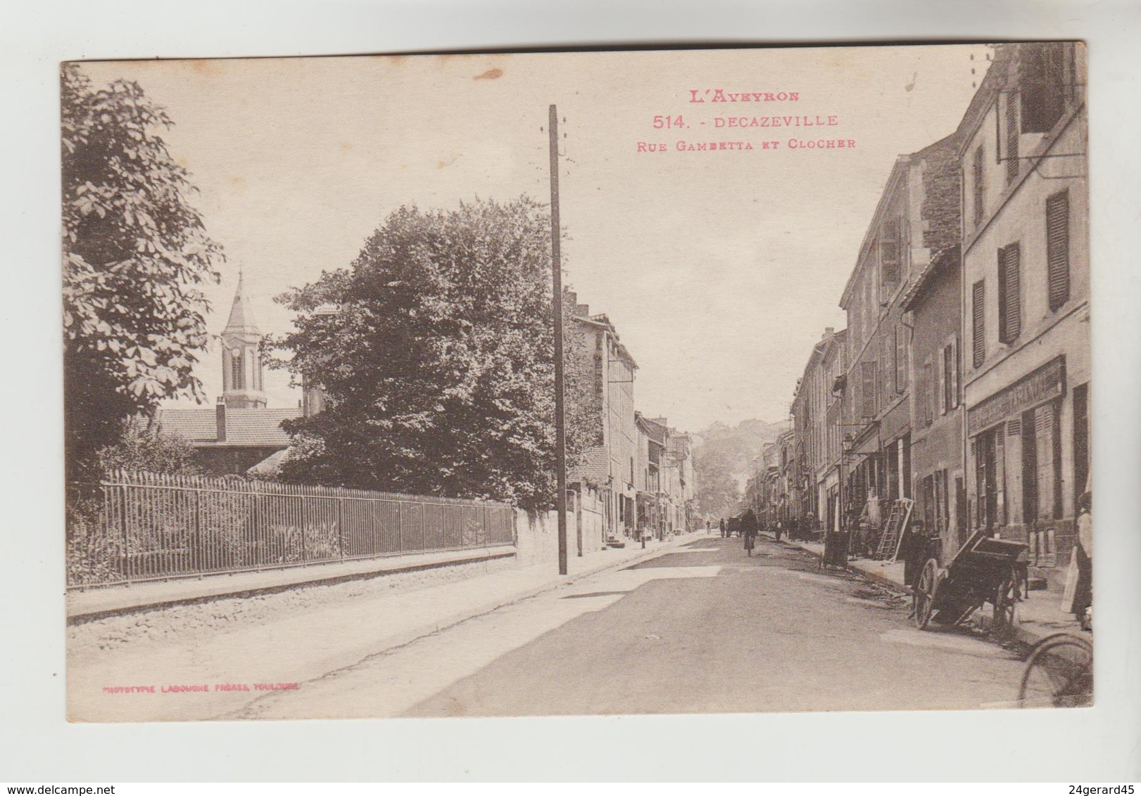 CPSM DECAZEVILLE (Aveyron) - Rue Gambetta Et Clocher - Decazeville