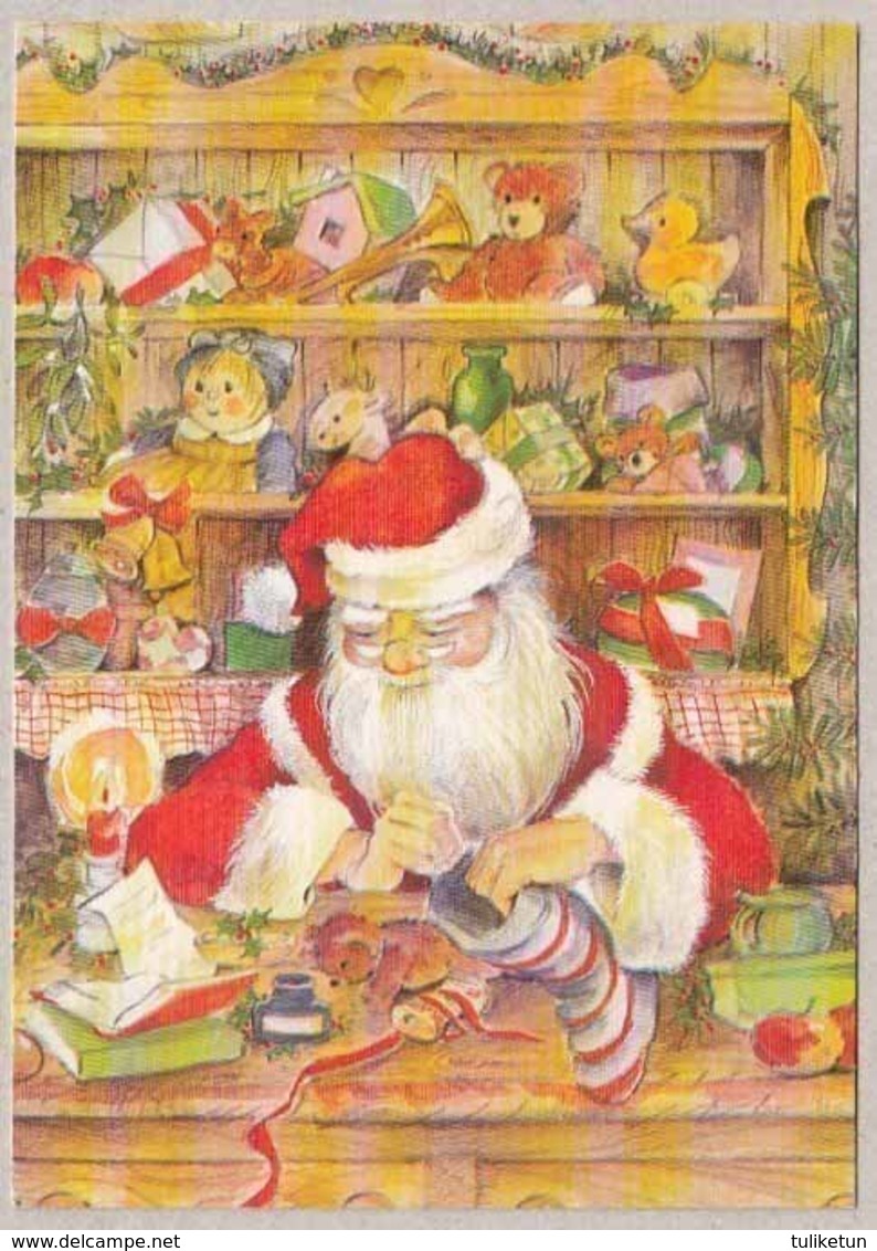Santa Claus Is Filling Christmas Sock - Santa Claus